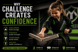 child in black martial arts uniform breaking bricks